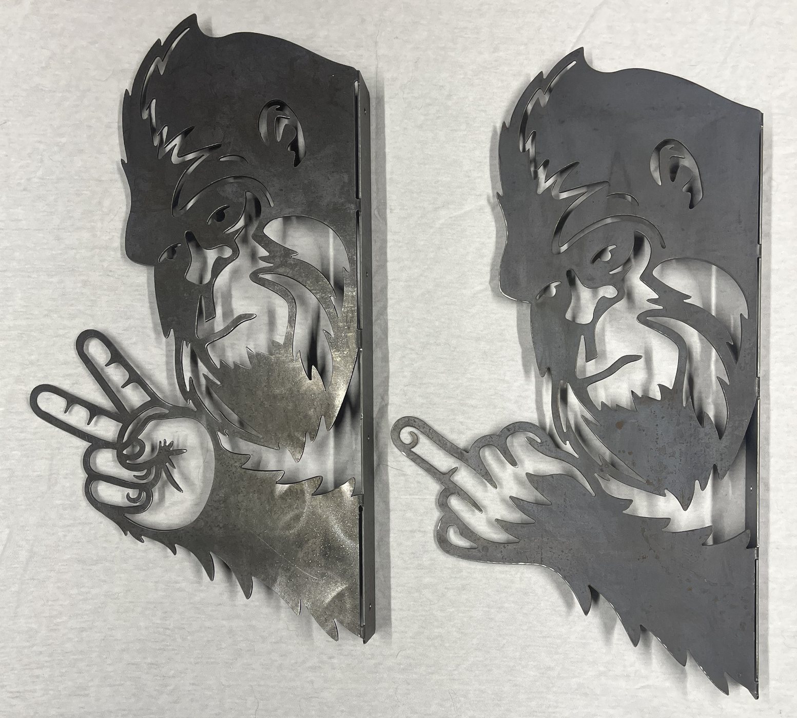 Large view of two plasma cut Bigfoot metal pieces