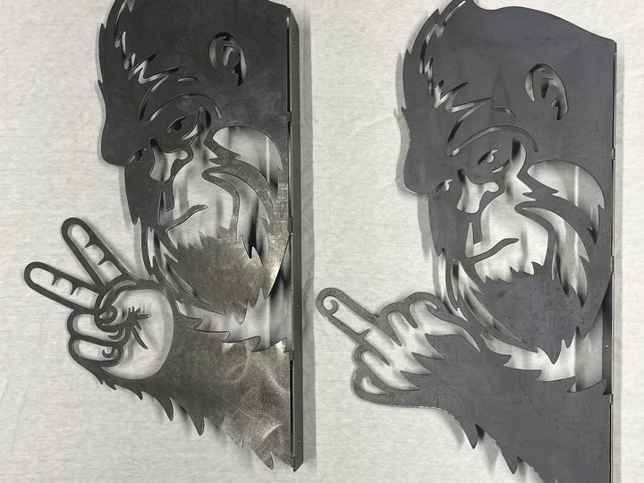 Small view of two plasma cut Bigfoot metal pieces