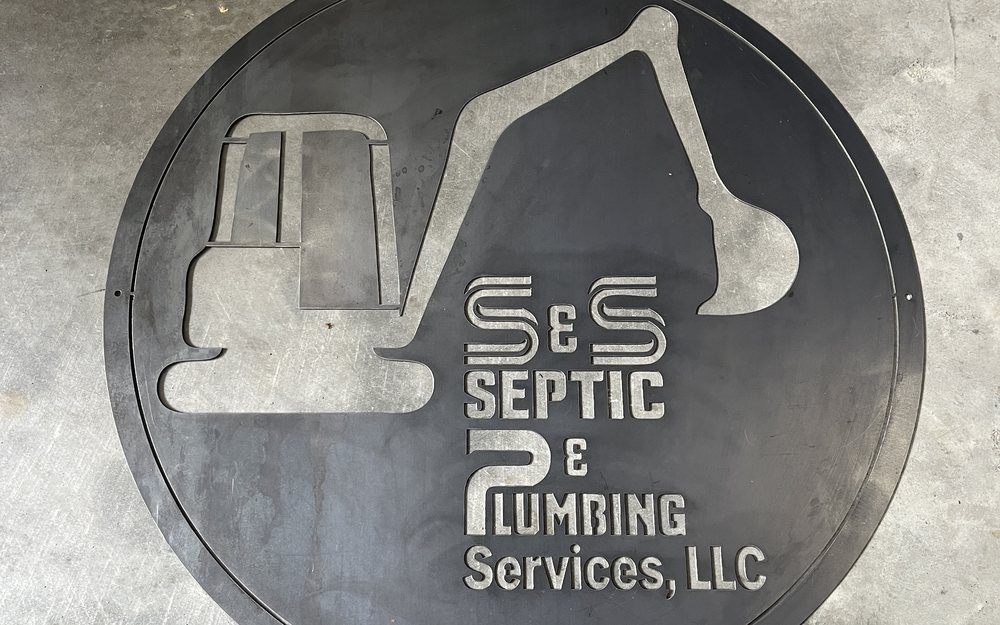 Custom plasma cut business sign for septic and plumbing services
