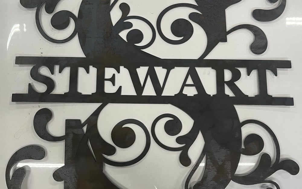 Custom plasma cut family name monogram in raw steel