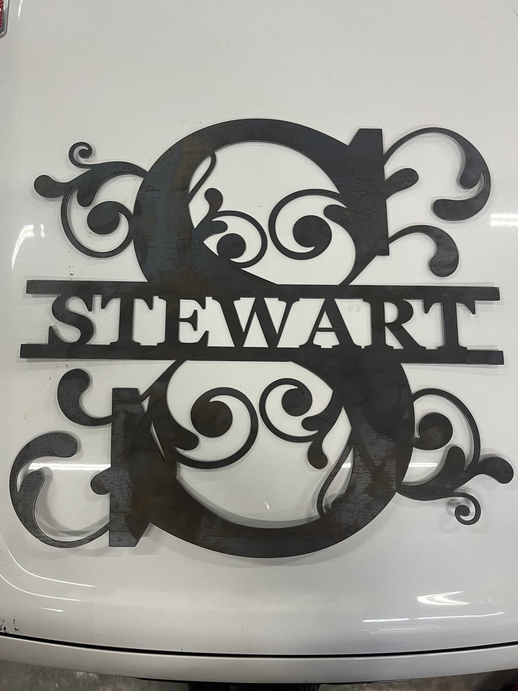 Large view of raw steel Stewart monogram